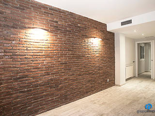 Reforma integral en calle Rosselló de Barcelona, Grupo Inventia Grupo Inventia Living room Bricks