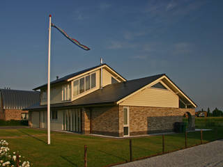 bouw woning Blauwestad, buro voor advies en architectuur pieter e. bolhuis buro voor advies en architectuur pieter e. bolhuis Casas de estilo rural Piedra