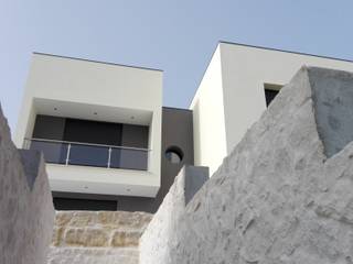 Casa A, handrade - arq handrade - arq Modern houses Stone