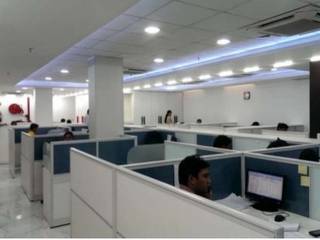 CORPORATE OFFICE INTERIORS, STATCON ENERGIA, NOIDA, DESINNOVA: modern by DESINNOVA,Modern