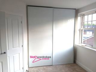 Two matching bespoke wardrobes with sliding doors for Clients home, Slide Wardrobes London Slide Wardrobes London Minimalist bedroom Glass