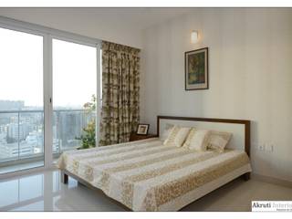 4 Bhk Apartment at Amanora, Pune, Akruti Interiors Pune Akruti Interiors Pune モダンスタイルの寝室 合板（ベニヤ板）