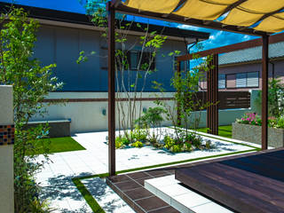 明るく優しいお庭に, 株式会社 岡本ガーデン 株式会社 岡本ガーデン Eclectic style garden Aluminium/Zinc