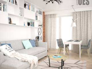 Miejsce na książki w salonie, OES architekci OES architekci Salas de estar escandinavas MDF Branco