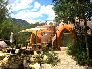Una Casa tipo Hobbit estilo Aldea, Domoterrra Domoterrra Log cabin
