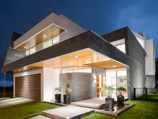 Casa L-G, J-M arquitectura J-M arquitectura Дома в стиле модерн Камень