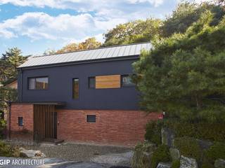 L-RED BRICK, GIP GIP Casas de estilo moderno