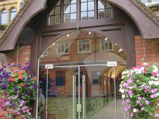 Double arched glass doors at Cranleigh School, Ion Glass Ion Glass مساحات تجارية زجاج