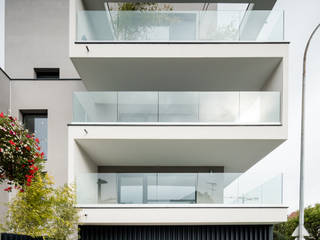 Apartment building Jean Jaures, OGGOstudioarchitects, unipessoal lda OGGOstudioarchitects, unipessoal lda Casas de estilo minimalista