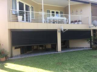 Fabric Awnings-Slide Track motorised, CASA Living CASA Living Modern balcony, veranda & terrace Aluminium/Zinc Brown
