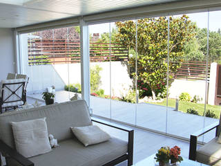 Cerramiento de cortina de cristal en Madrid, Fraimar Aluminios S.L. Fraimar Aluminios S.L. Balcones y terrazas de estilo moderno Aluminio/Cinc