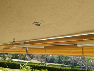 Toldo en Ixtapa, Zihuatanejo, Interiorismo 3P Interiorismo 3P Moderne balkons, veranda's en terrassen Textiel Amber / Goud