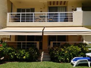 Toldo en Ixtapa, Zihuatanejo, Interiorismo 3P Interiorismo 3P بلكونة أو شرفة الغزل والنسيج Amber/Gold