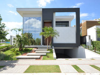 Fachada Moderna em Pele de Vidro, Andréa Generoso - Arquitetura e Construção Andréa Generoso - Arquitetura e Construção Minimalist house Granite