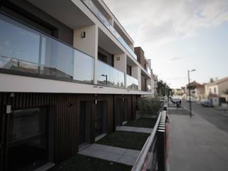 Du Camp residential buildings, OGGOstudioarchitects, unipessoal lda OGGOstudioarchitects, unipessoal lda Multi-Family house Wood Wood effect