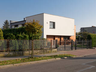 Modernizacja domu kostki, Architekt Adam Wawoczny Architekt Adam Wawoczny 一戸建て住宅 木 木目調