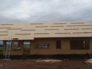Casa en Uruguay (Construcción en 15 días) Superficie cubierta de 130 m2, Patagonia Log Homes - Arquitectos - Neuquén Patagonia Log Homes - Arquitectos - Neuquén Wooden houses Engineered Wood Wood effect