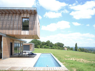 Maison en bois et béton esprit Loft, Créateurs d'Interieur Créateurs d'Interieur Garden Pool Wood