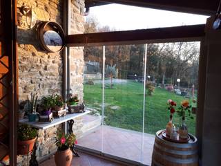 Veranda con Vetrate panoramiche, Svitavvita Snc Svitavvita Snc Jardines de invierno de estilo rústico