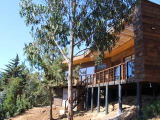 VIVIENDA EN FUNDO MILLACO, KIMCHE ARQUITECTOS KIMCHE ARQUITECTOS Chalés e casas de madeira Madeira Efeito de madeira