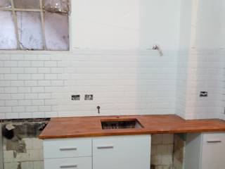 Remodelación cocina capital, Constructora del Este Constructora del Este Built-in kitchens Ceramic