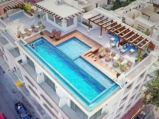 Las piscinas y albercas más hermosas, UG ARQUITECTOS UG ARQUITECTOS Hồ bơi phong cách tối giản Gạch ốp lát