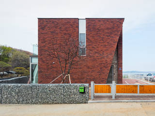 파주 서패동 단독주택, 큐제이아키텍쳐 QJARCHITECTURE 큐제이아키텍쳐 QJARCHITECTURE Buitenhuis Stenen