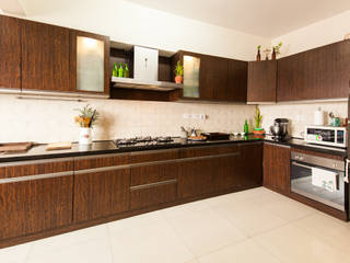 Sabin sam's Apartment at Salarpuria Sattva Greenage, Mist Turnkey Interiors Mist Turnkey Interiors مطبخ خشب رقائقي