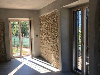 Ristrutturazione del casale di campagna con infissi in pvc Schuco, Modoal Modoal Rustic style windows & doors Wood-Plastic Composite