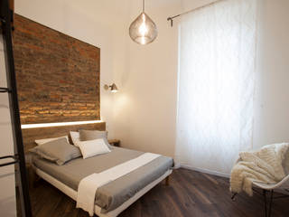 NOT ANOTHER BRICK IN THE WALL, GruppoTre Architetti GruppoTre Architetti Modern style bedroom