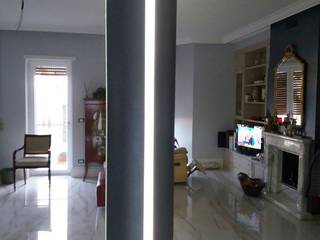 Realizzazione di una bellissima colonna LED in polistirene resinato. Trasformazione da un pilastro quadrato ad uno tondo., Arte Design & Colore Arte Design & Colore Modern Living Room Metallic/Silver