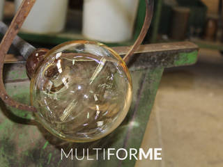 Custom chandeliers in Murano glass for a Private Flat in Milan, Italy, MULTIFORME® lighting MULTIFORME® lighting Вітальня Скло Янтарний / Золотий