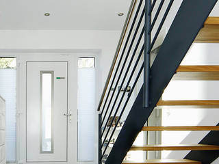 Harmonischer Dreiklang, STREGER Massivholztreppen GmbH STREGER Massivholztreppen GmbH Pasillos, vestíbulos y escaleras modernos Hierro/Acero