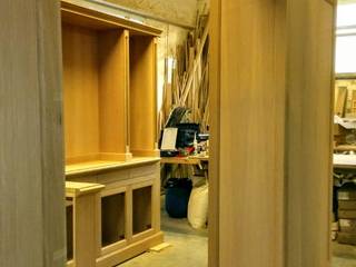 Soggiorno con librerie, Falegnameria su misura Falegnameria su misura Living roomCupboards & sideboards Wood