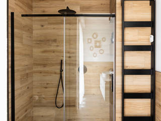 Quando il rivestimento effetto legno è il vero protagonista., Atrio_ abitare bene Atrio_ abitare bene Casas de banho modernas