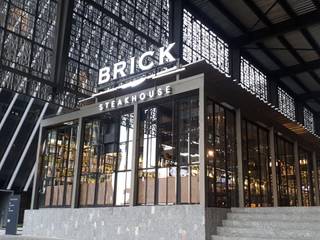 Brick Steakhouse GDL, Santuario arquitectura + Santuario arquitectura + Spazi commerciali Ferro / Acciaio
