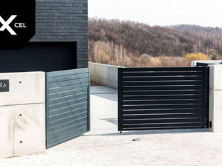 Simply Concrete. Nowoczesne ogrodzenie z betonu i aluminium, XCEL Fence XCEL Fence Jardines delanteros