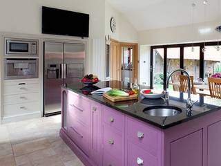 Plum kitchen Island by Christopher Howard Christopher Howard Built-in kitchens لکڑی Pink Kitchen renovation, Scottish country kitchen, Scottish steading renovation, Steading kitchen, tradtional kitchen, kitchen mantel, corbels, mantle with corbels, white country kitchen, plum kitchen island, kitchen island, white and plum colour scheme, kitchen display shelves, glass fronted shelves, chrome finishes, occhio lighting, pendant lights, range cooker, boiling water tap, Belfast sink, double Belfast sink