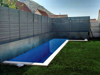 Piscina con cascada de agua y Treillage gris, Piscinas con Diseño Chile Piscinas con Diseño Chile Garden Pool Concrete