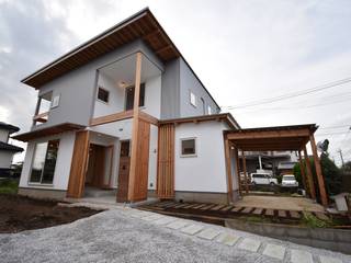 郊外の２世帯住宅 , たましま設計施工社 たましま設計施工社 Casas multifamiliares Madera Acabado en madera
