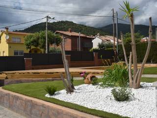 Creación de jardín con césped artificial., GS JARDINERIA GS JARDINERIA Rock Garden