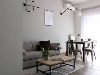 Modern industrial - restyling appartamento, Arching - Architettura d'interni & home staging Arching - Architettura d'interni & home staging Industrial style living room Grey