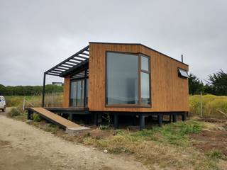 VIVIENDA MINIMA SECTOR PANGAL, KIMCHE ARQUITECTOS KIMCHE ARQUITECTOS Minimalist house Wood Wood effect