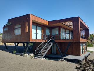 LOTE 28, TAIVARUA PICHILEMU, KIMCHE ARQUITECTOS KIMCHE ARQUITECTOS Mediterranean style house Wood Wood effect