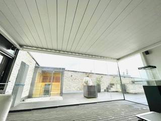 Terrassenverglasung auf einer Dachterrasse in Linz, Schmidinger Wintergärten, Fenster & Verglasungen Schmidinger Wintergärten, Fenster & Verglasungen Anexos de estilo moderno