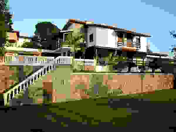 CHASTINET ARQUITETURA URBANISMO ENGENHARIA LTDA Country style house Bricks Wood effect