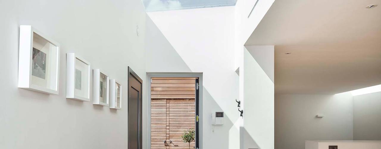 A single-storey Courtyard House: East Dulwich , Designcubed Designcubed Salas de jantar modernas