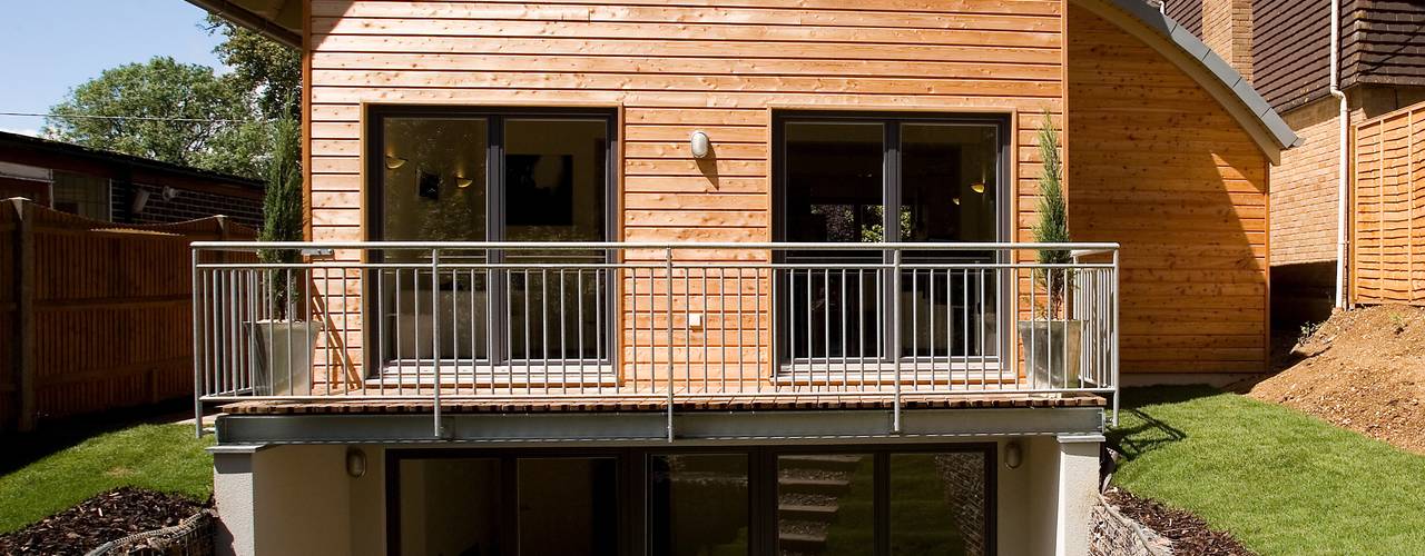 Timber Clad Passive House with Curved Roof, haus ltd haus ltd Modern living