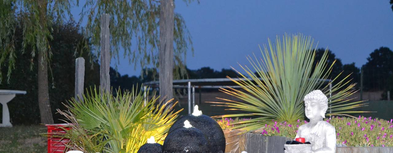 Création d’un univers contemporain intégrant une terrasse mixte, travertin de marbre blanc et bois composite gris anthracite, un parterre en palis d’ardoise avec éclairage et fontaine, EURL OLIVIER DUBOIS EURL OLIVIER DUBOIS Moderner Garten