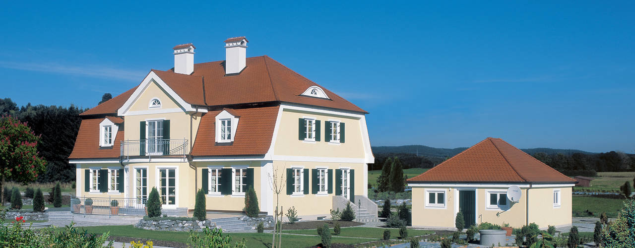 Traditionelle Landhausvilla, Bau-Fritz GmbH & Co. KG Bau-Fritz GmbH & Co. KG Casas de campo